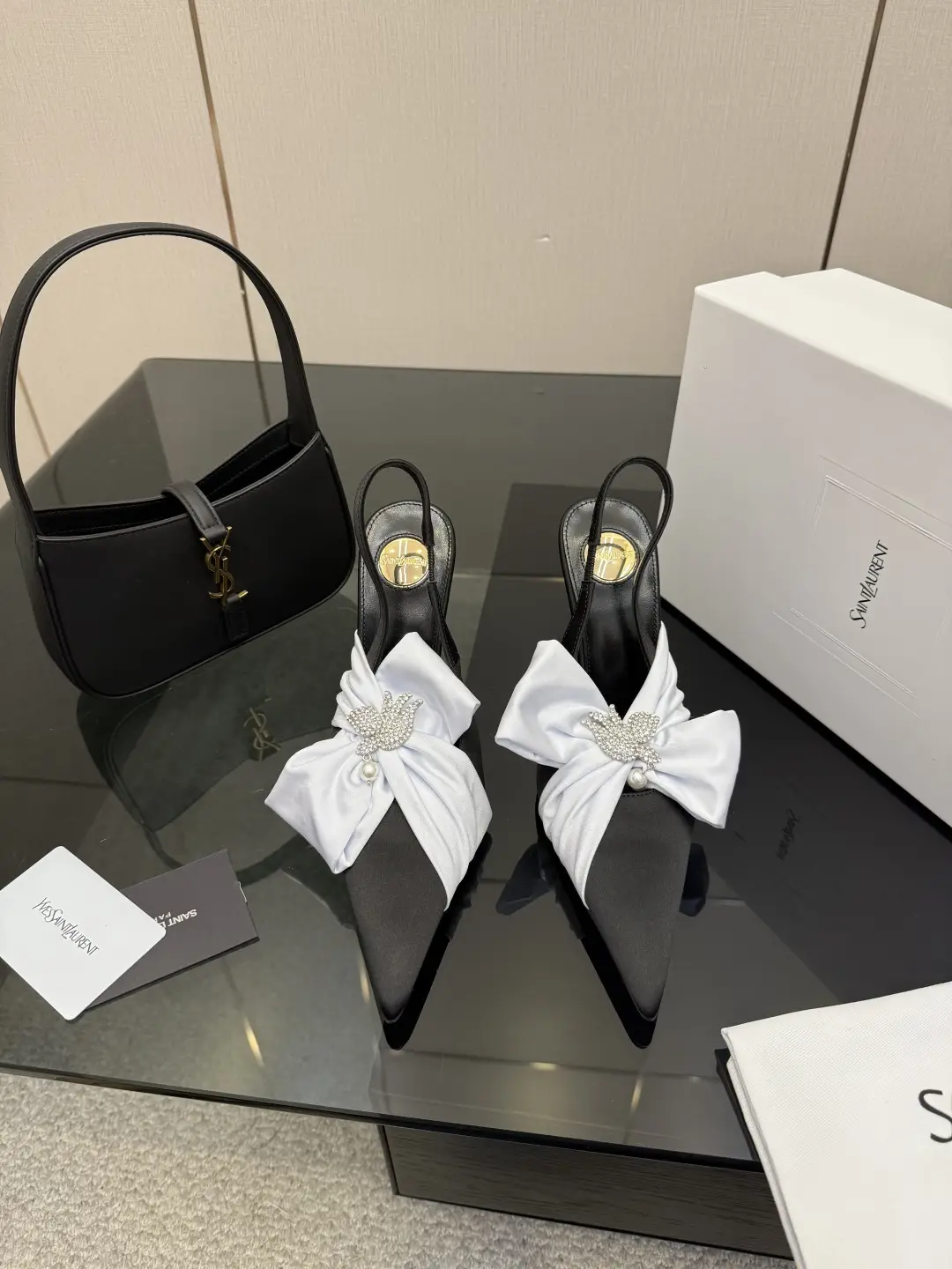 three hundred
Saint Laurent bow sandals with pointed tips