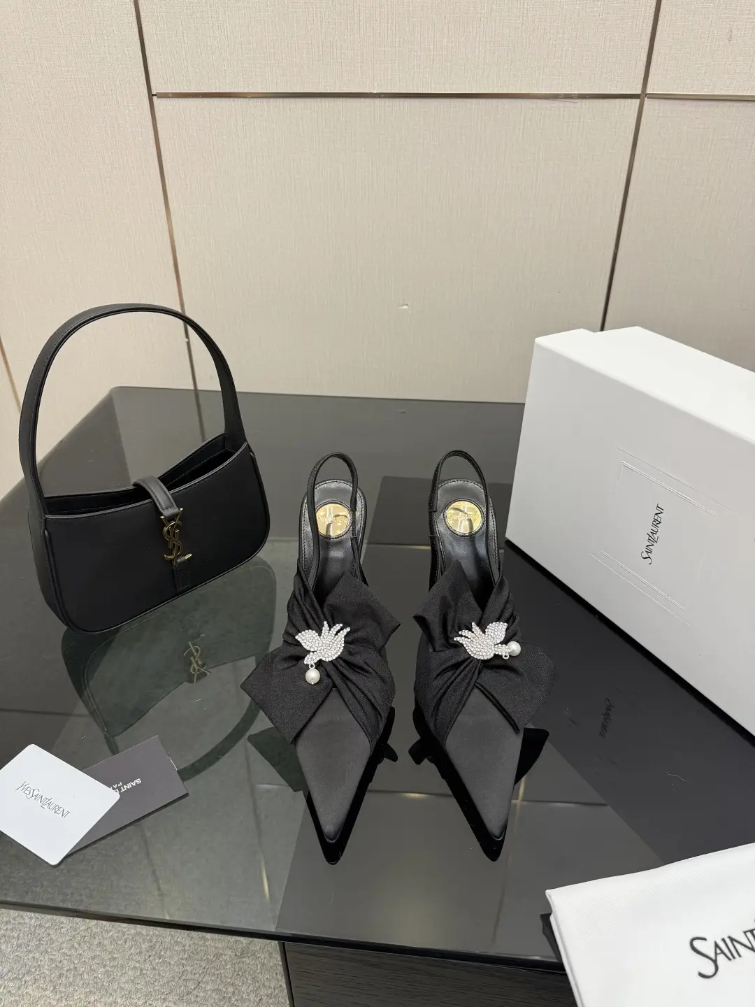 three hundred
Saint Laurent bow sandals with pointed tips