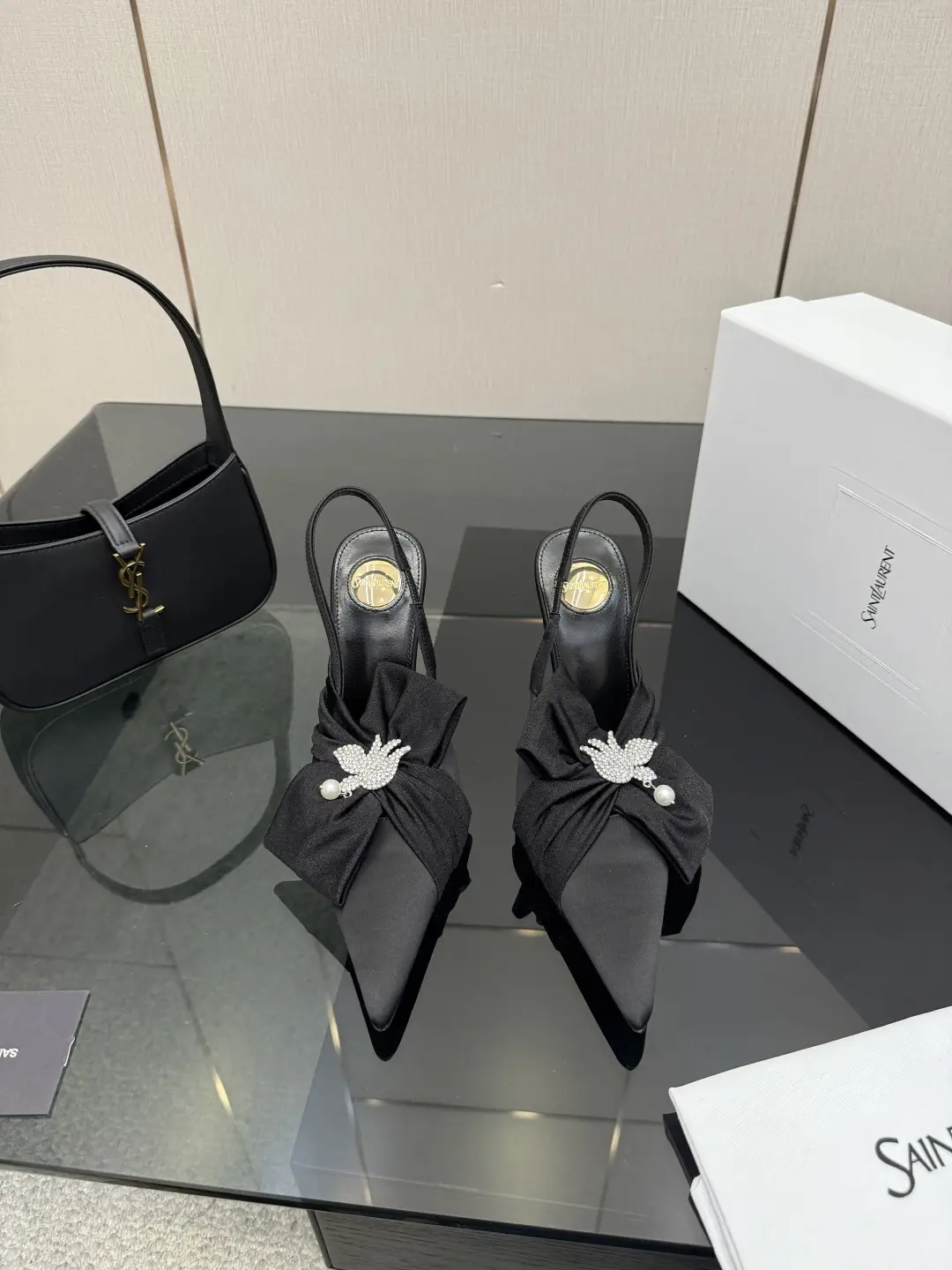 three hundred
Saint Laurent bow sandals with pointed tips