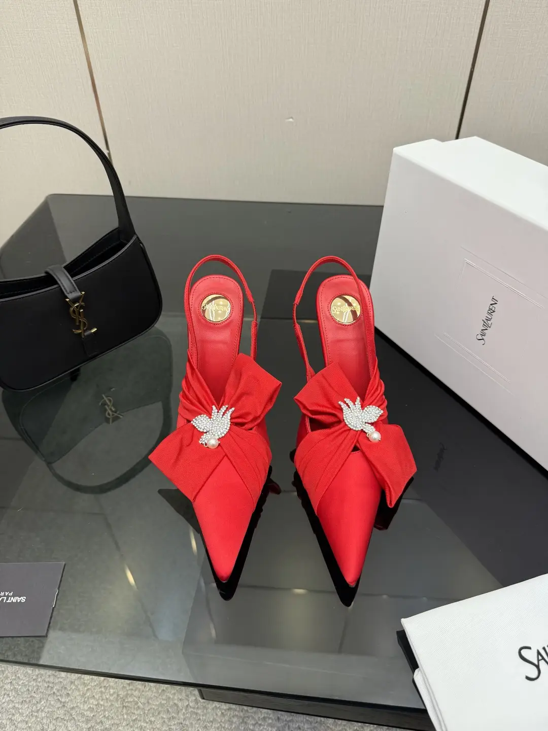 three hundred
Saint Laurent bow sandals with pointed tips