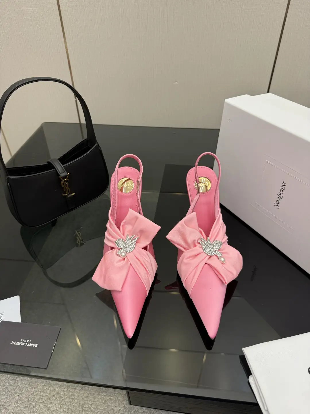 three hundred
Saint Laurent bow sandals with pointed tips