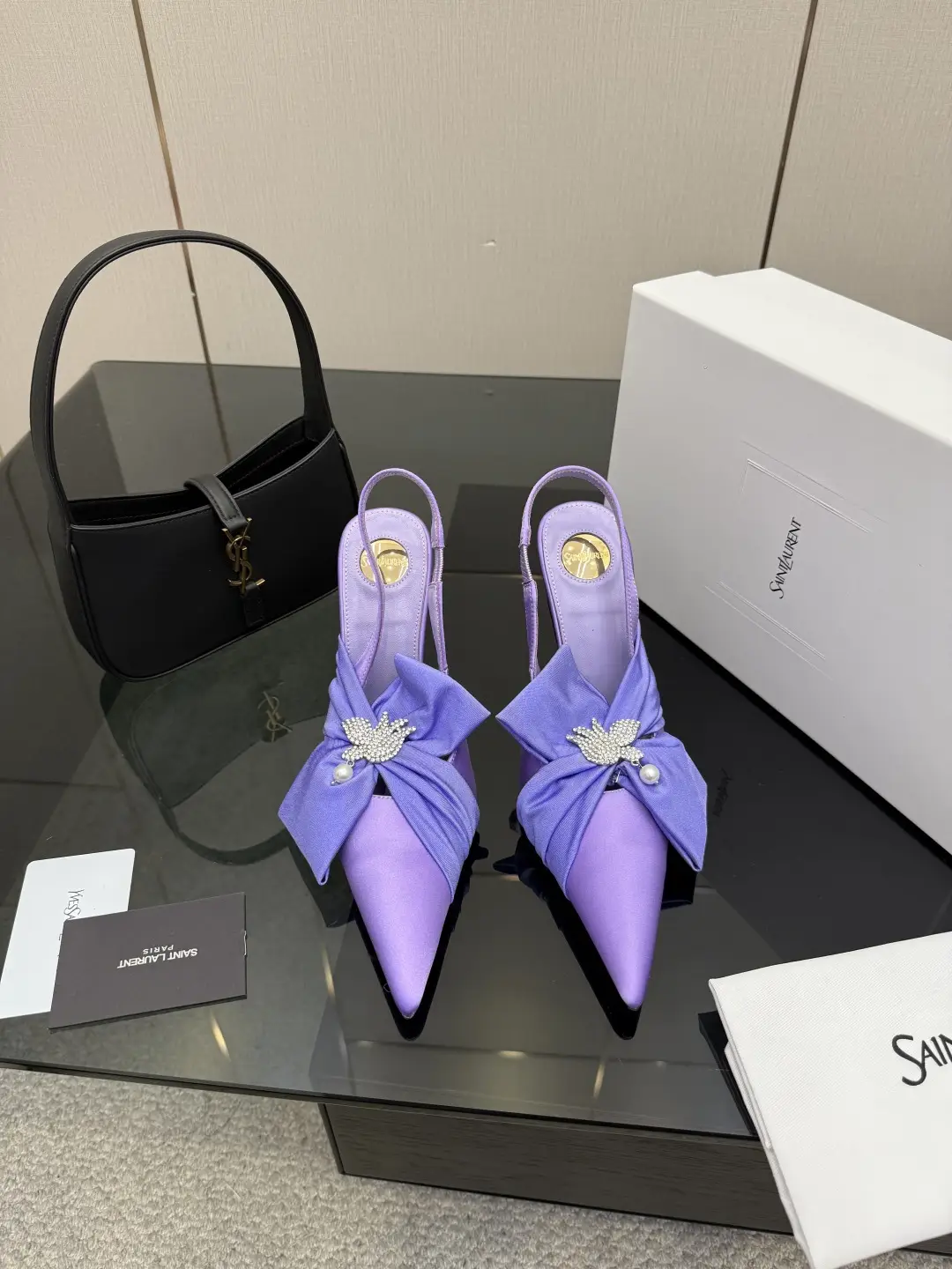three hundred
Saint Laurent bow sandals with pointed tips