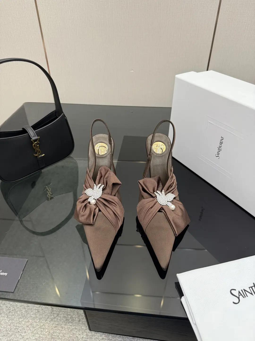 three hundred
Saint Laurent bow sandals with pointed tips