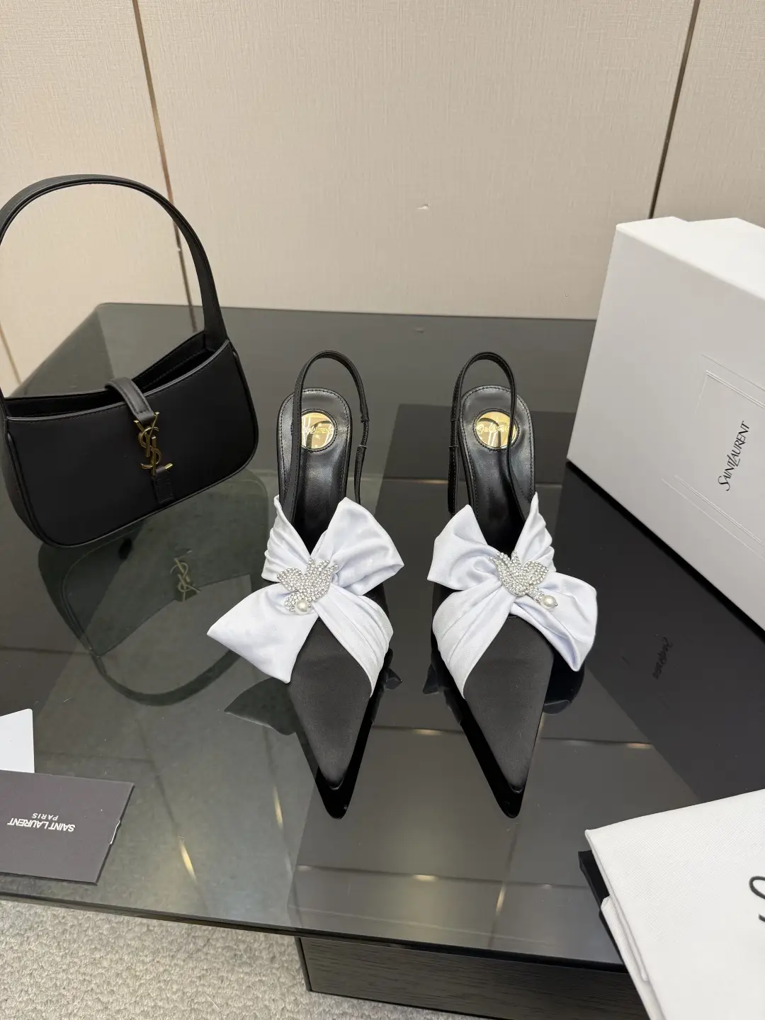 three hundred
Saint Laurent bow sandals with pointed tips