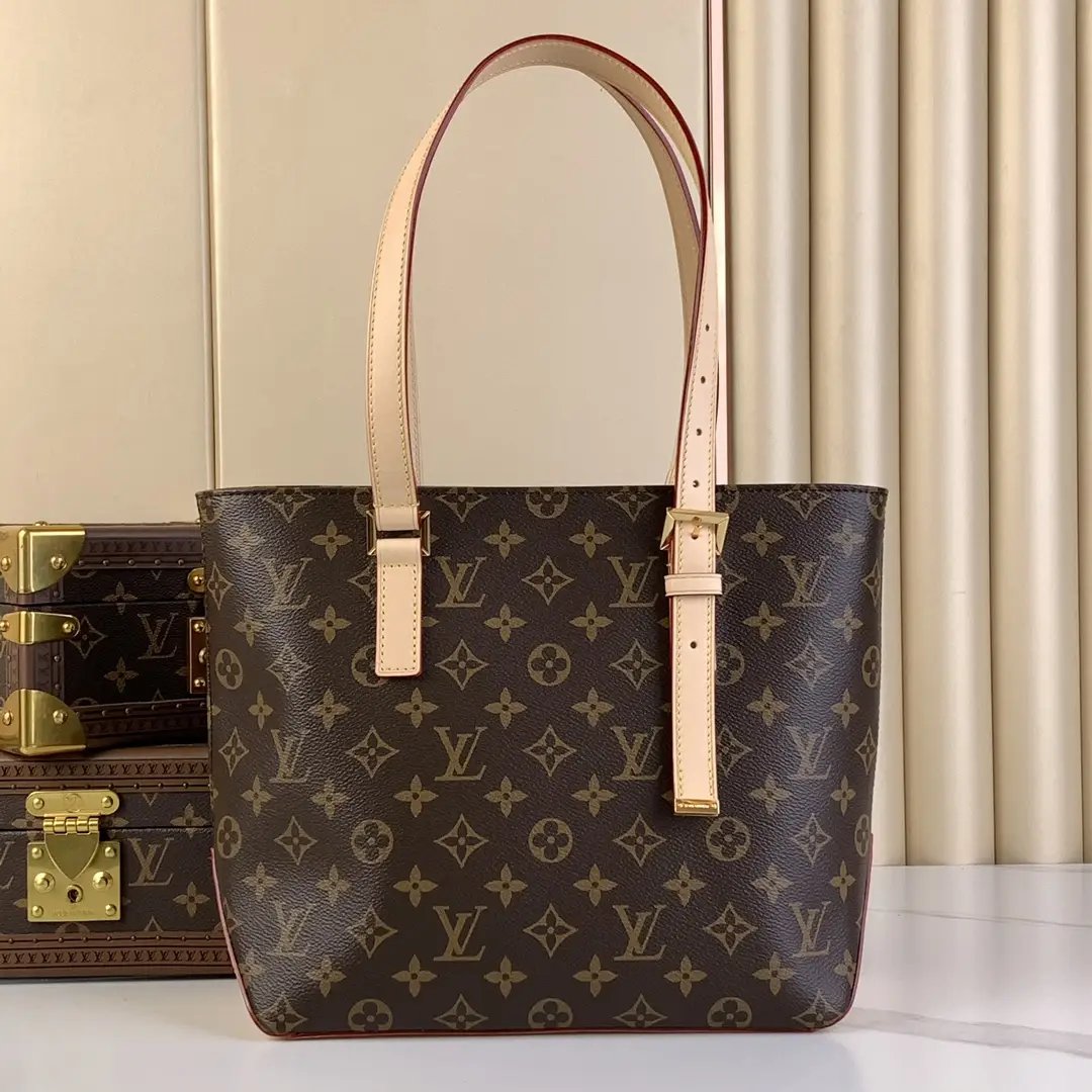 The m12095 Piano handbag features a sleek design and side triangular leather to enhance the M