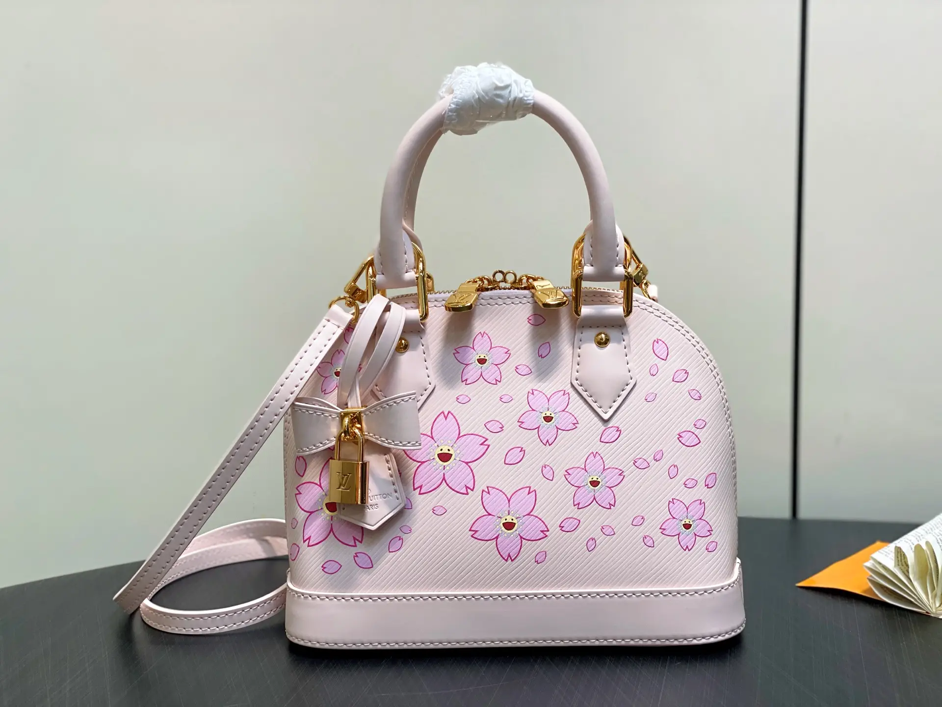 M13104 pink M40302 cherry blossom water ripple shell bag LV × TM a